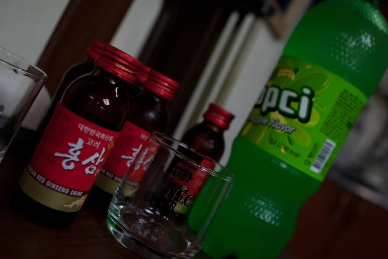 various beverages sit on the table beside each other