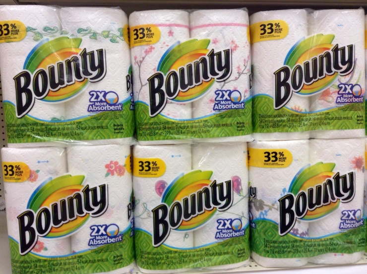 several rolls of bounty are stacked on the shelf