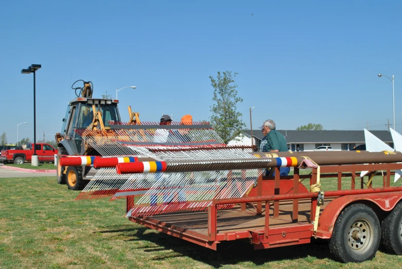 a truck is full of large logs that look like pipes