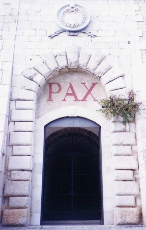a building with a sign that reads pax above the entrance