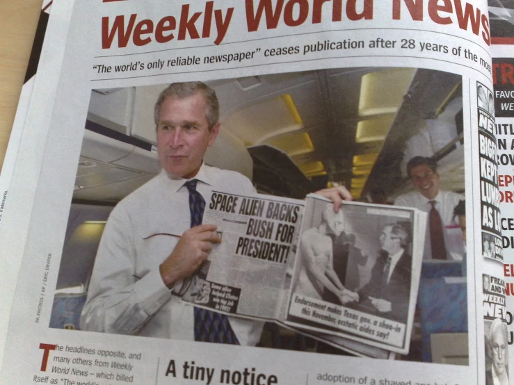 newspaper article with man in plane reading a newspaper