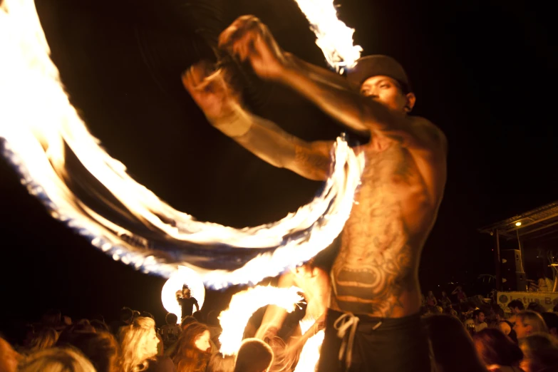 this is a man holding a fire dance around a circle
