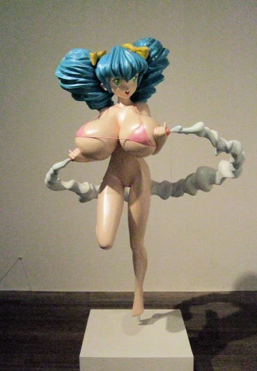 a female figure posed with a plastic contraption in a display