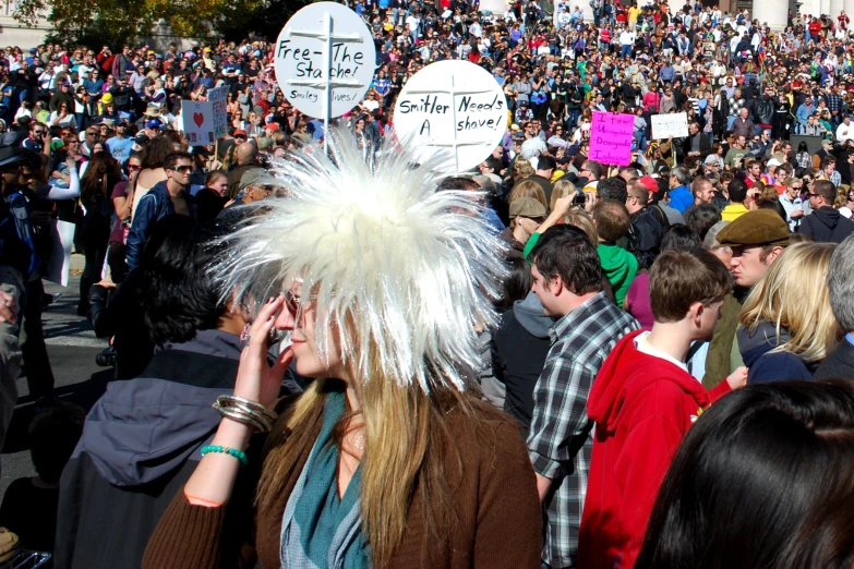 a crowd is gathered outside on cell phones