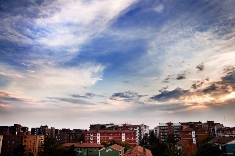 a bird flying in the sky above houses