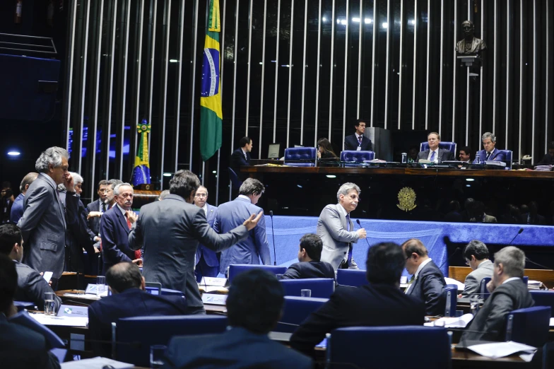 group of people gathered at tables for a meeting