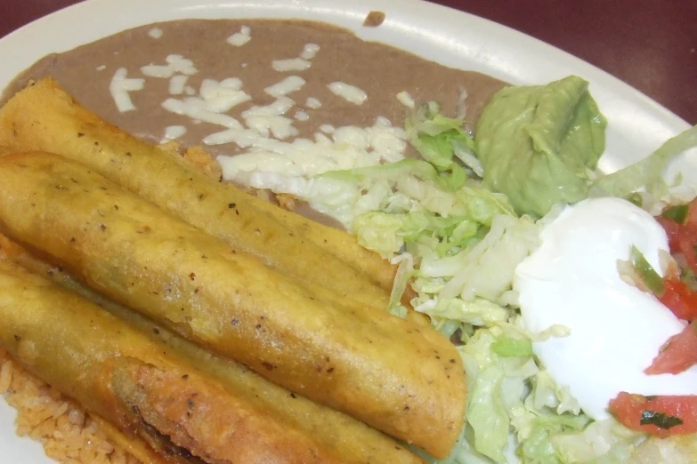 a plate with a pile of rice and some food on it