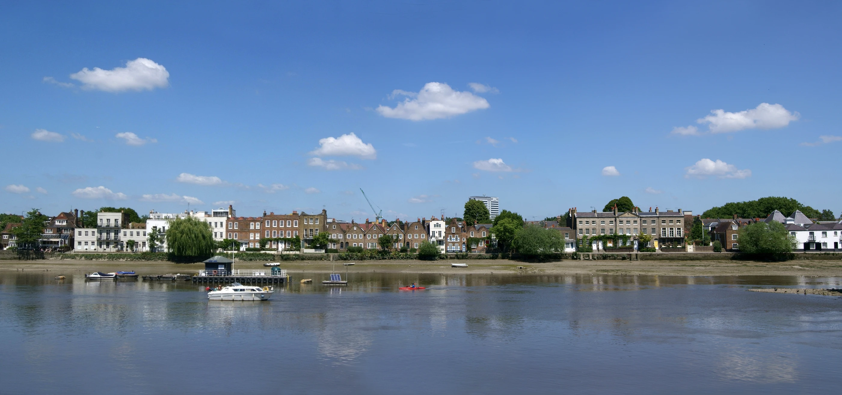 a group of small boats that are floating on the water