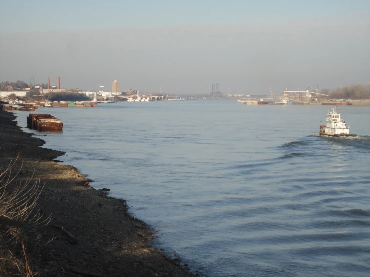 a tugboat makes its way down a canal