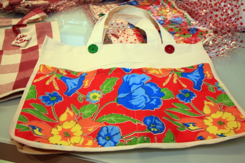 a colorful bag made from old fabric and some ons