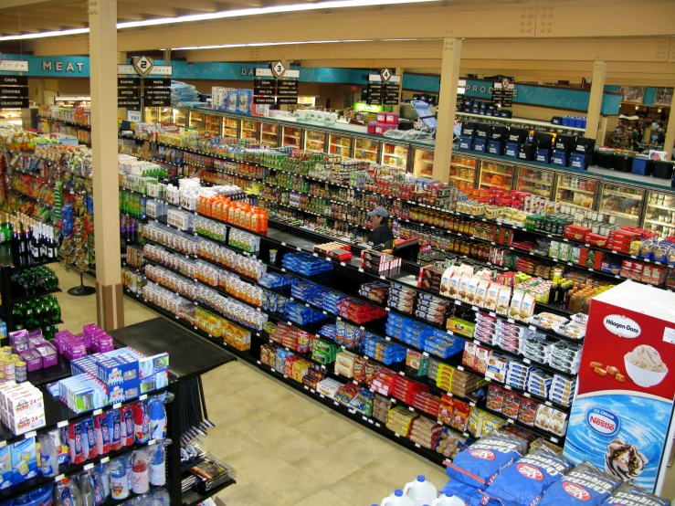 an indoor grocery store displays all kinds of milk, milk, and other products