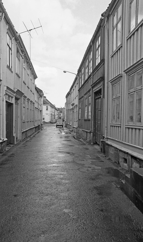 black and white image of empty street during day
