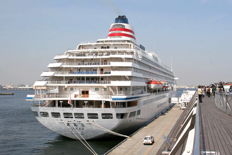 a large cruise ship parked at a pier