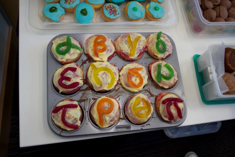 many different type of cupcakes with letters