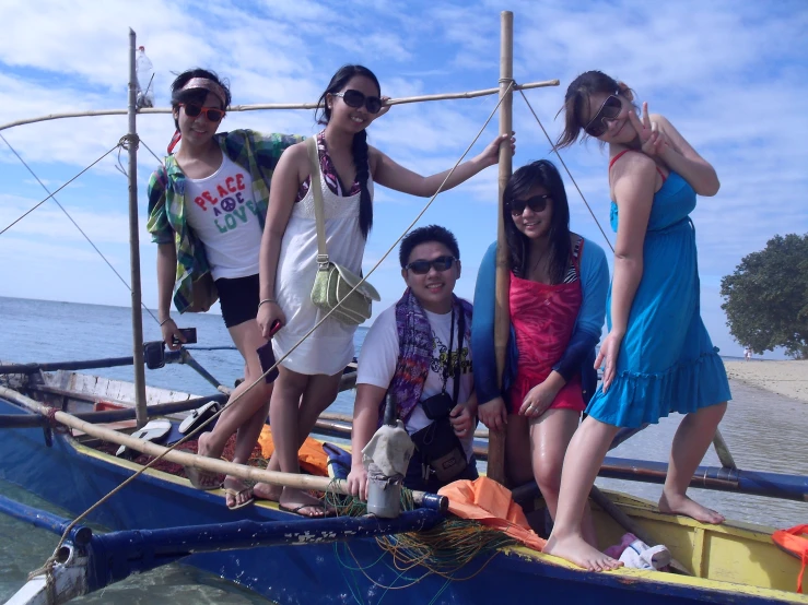 four women on a boat on the water