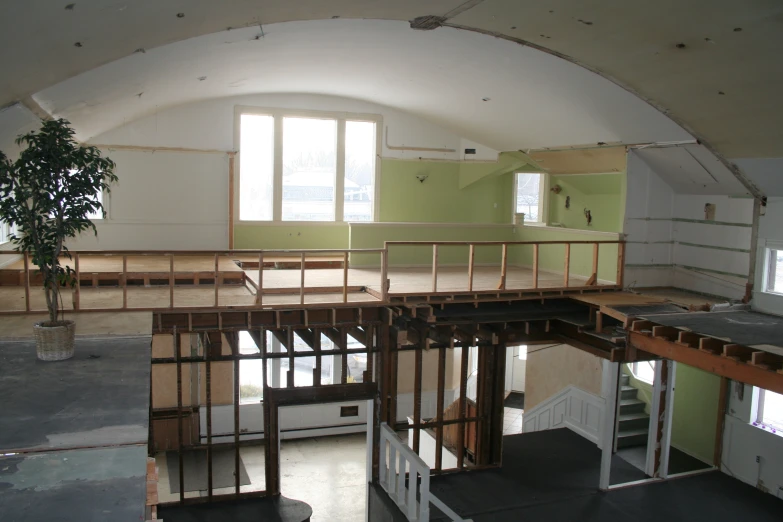 a view of an empty loft with windows and bars