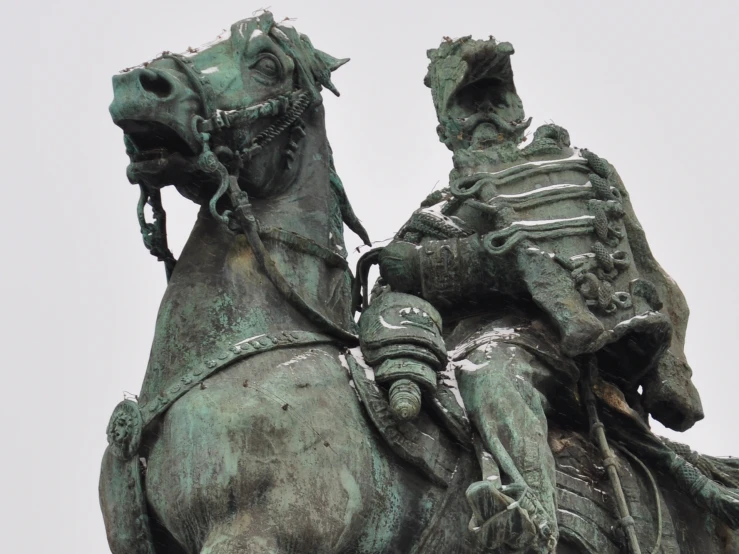 a large statue of a person on top of a horse