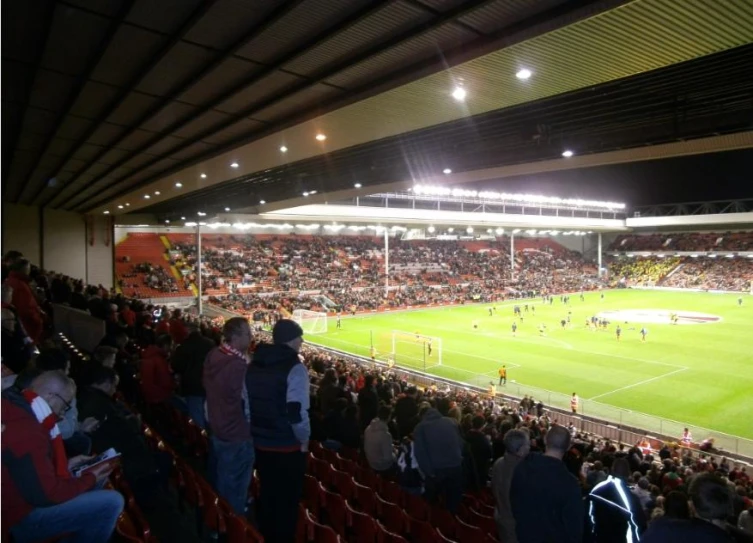 an indoor soccer game in a stadium is being played