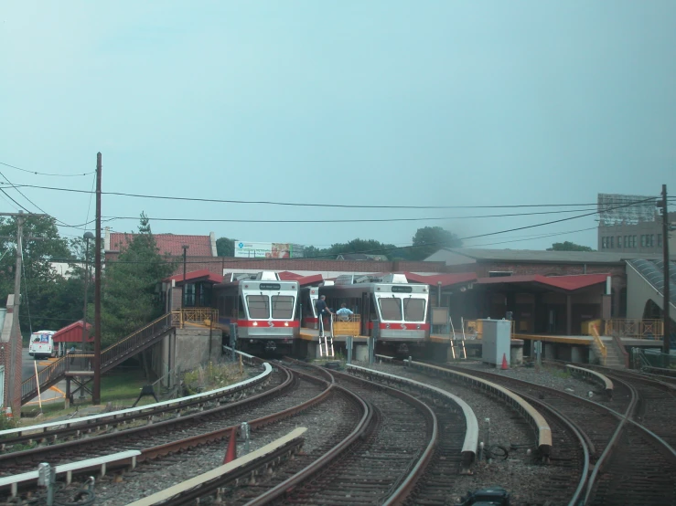 two trains sitting on top of train tracks