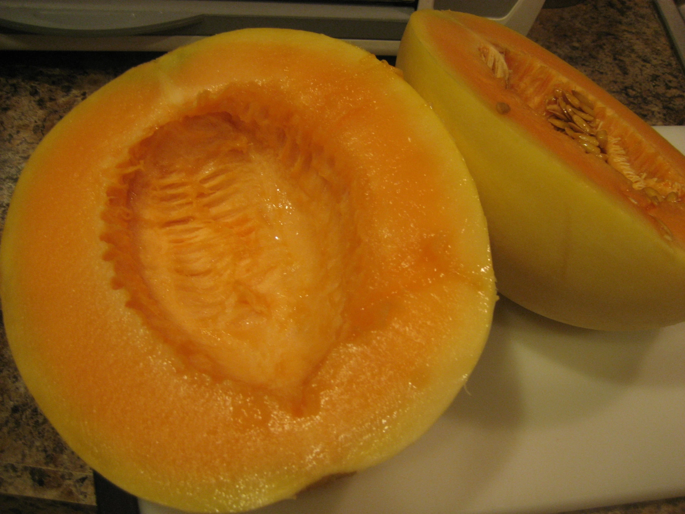 sliced orange fruit sitting on a  board