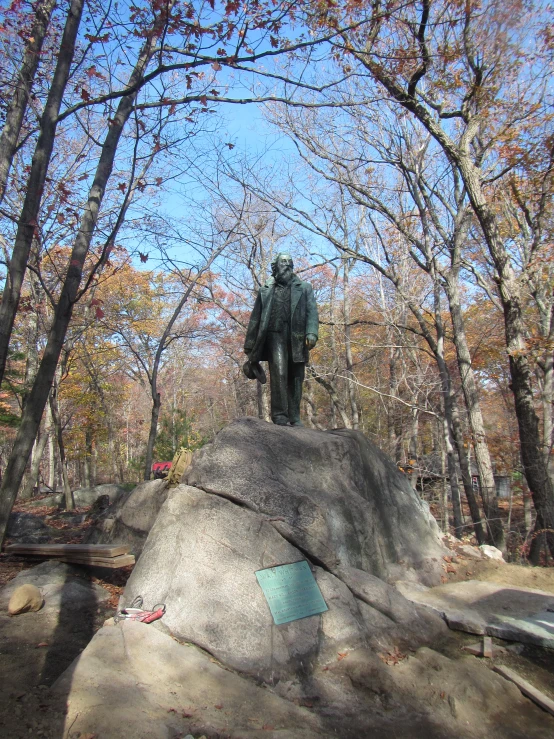 a large rock with a statue of an elephant in the middle