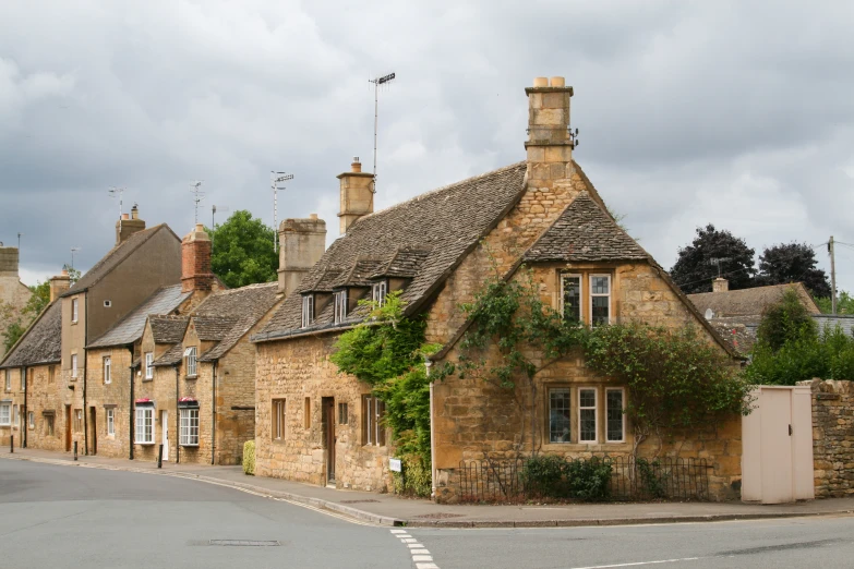 some old stone buildings are lined on a street