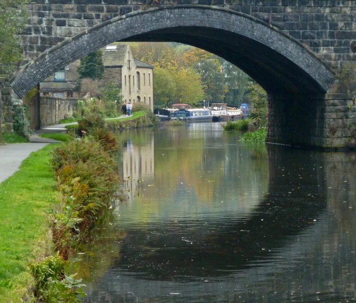 the canal is surrounded by small brick buildings