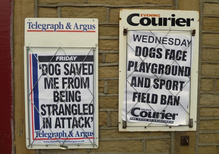 a pair of signs that are attached to a building