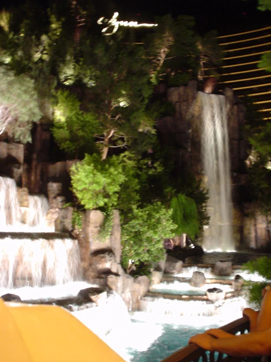 this is an outdoor waterfall park at night