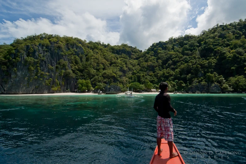 a man in a boat on a body of water