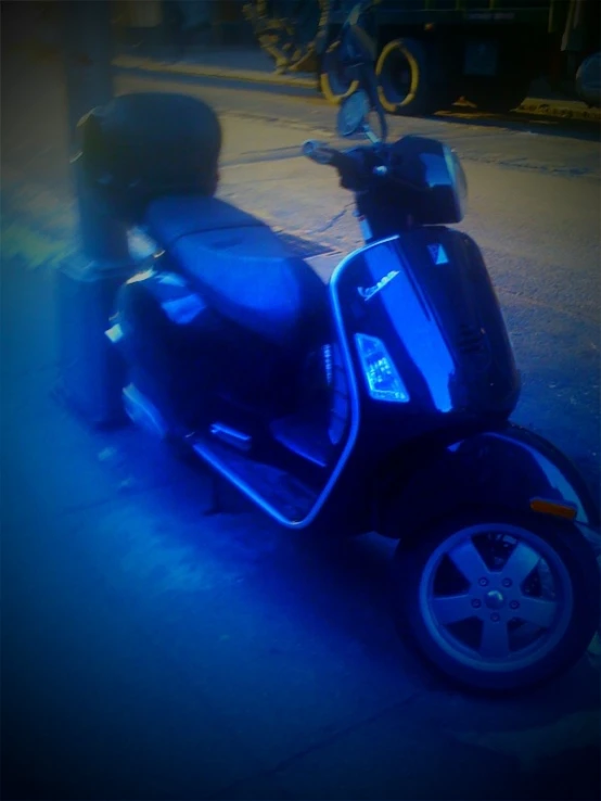 a scooter is shown with the light on