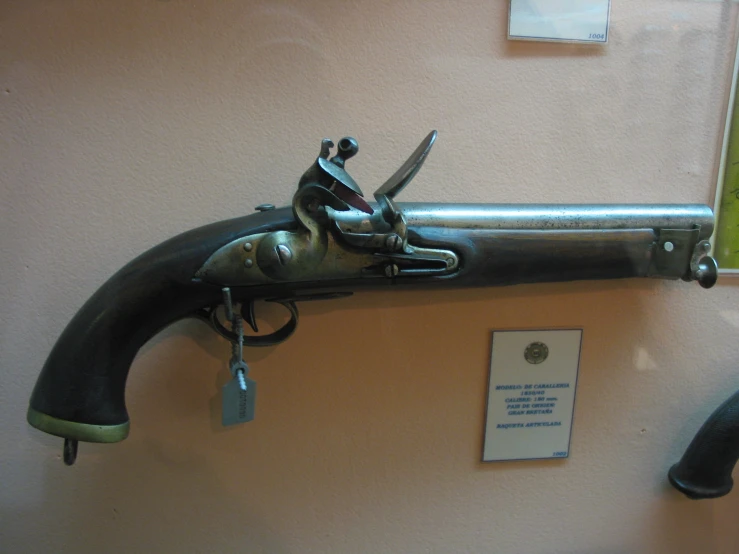 a faucet that is on display behind a wall