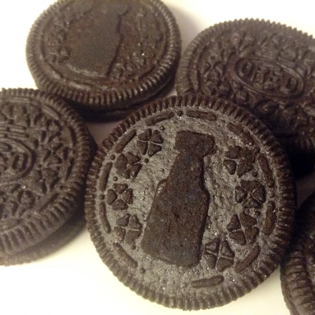 a pile of oreo cookies sitting on top of a white table