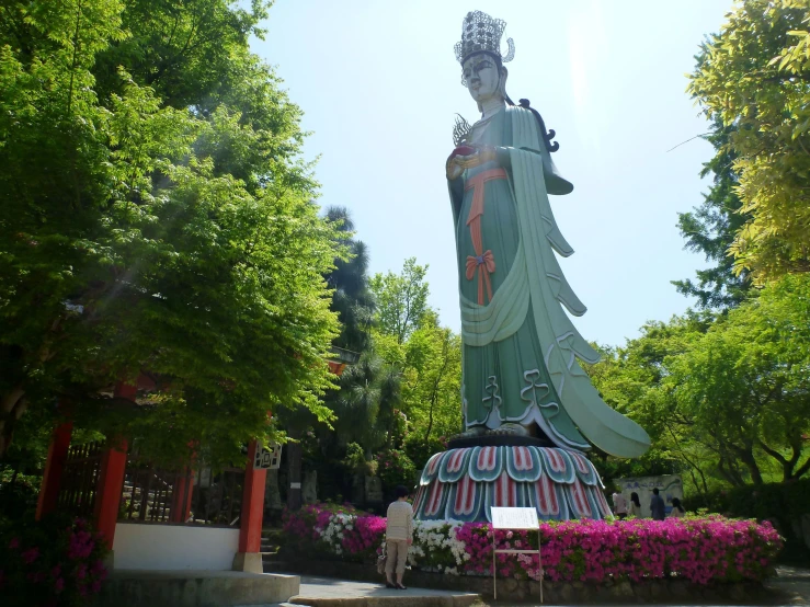 a large statue of buddha in a park