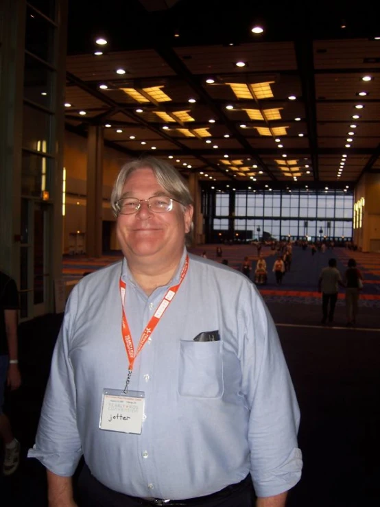 man standing in an indoor building for an event