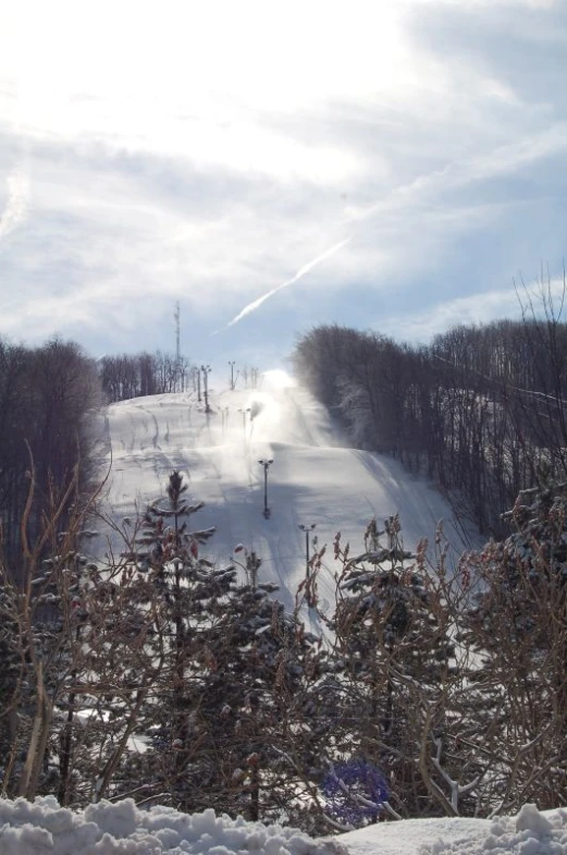 snow covered area with a ski run down the slope