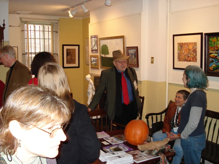 a group of people at an art exhibition