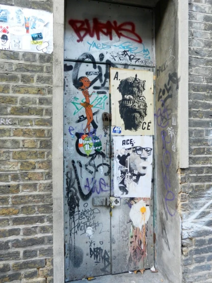 graffiti is posted on the doors of a building