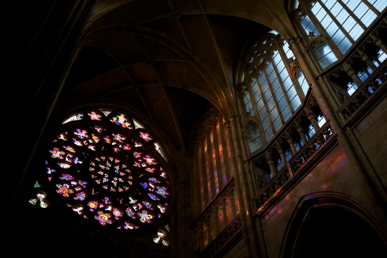 stained glass window in the ceiling of a gothic structure