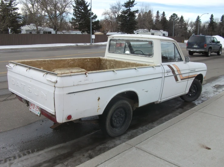 a pick up truck with an old box