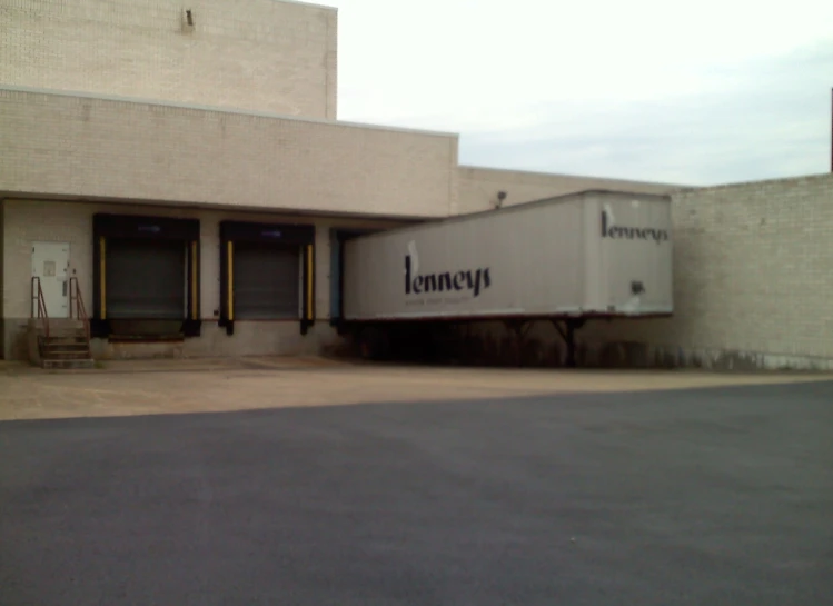 the front of a building with a truck parked in front