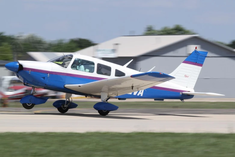 a single engine prop plane with passengers on a runway