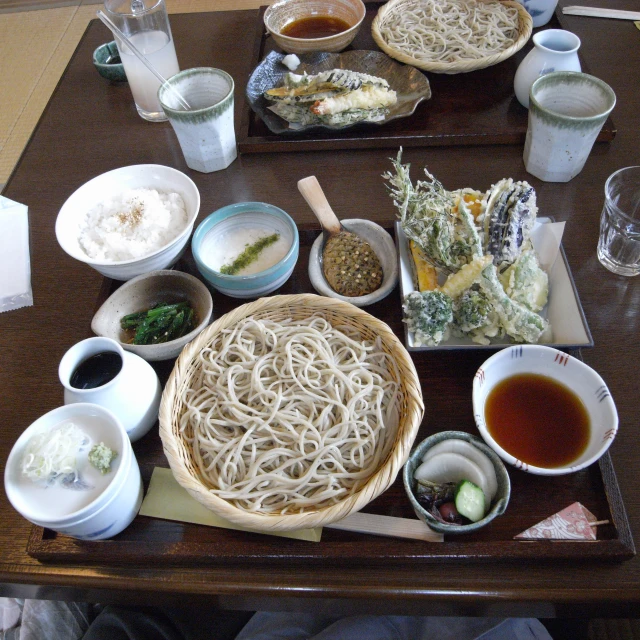 the food is spread out neatly on the dining table