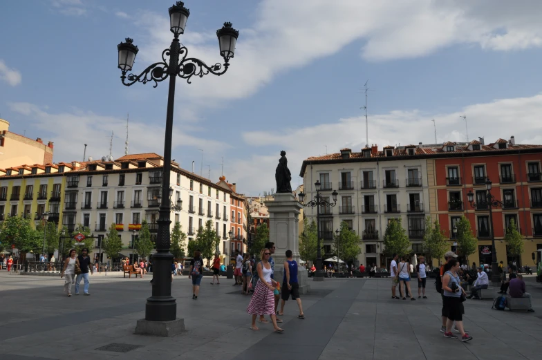 people are walking around in the street near some buildings