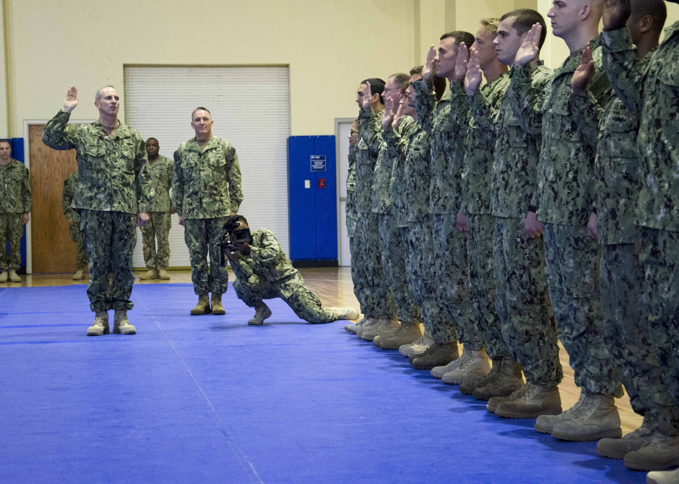 a person on a military floor posing for pictures