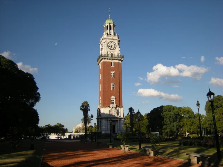 a tall brick tower with a clock on each of it's sides