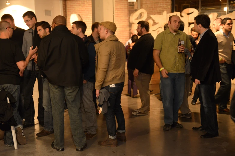 several men standing in a group having a discussion