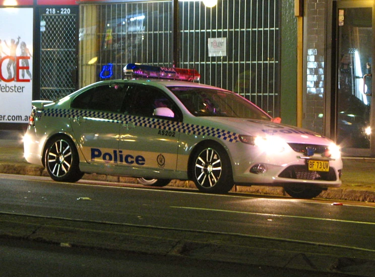 a police car is parked on a street