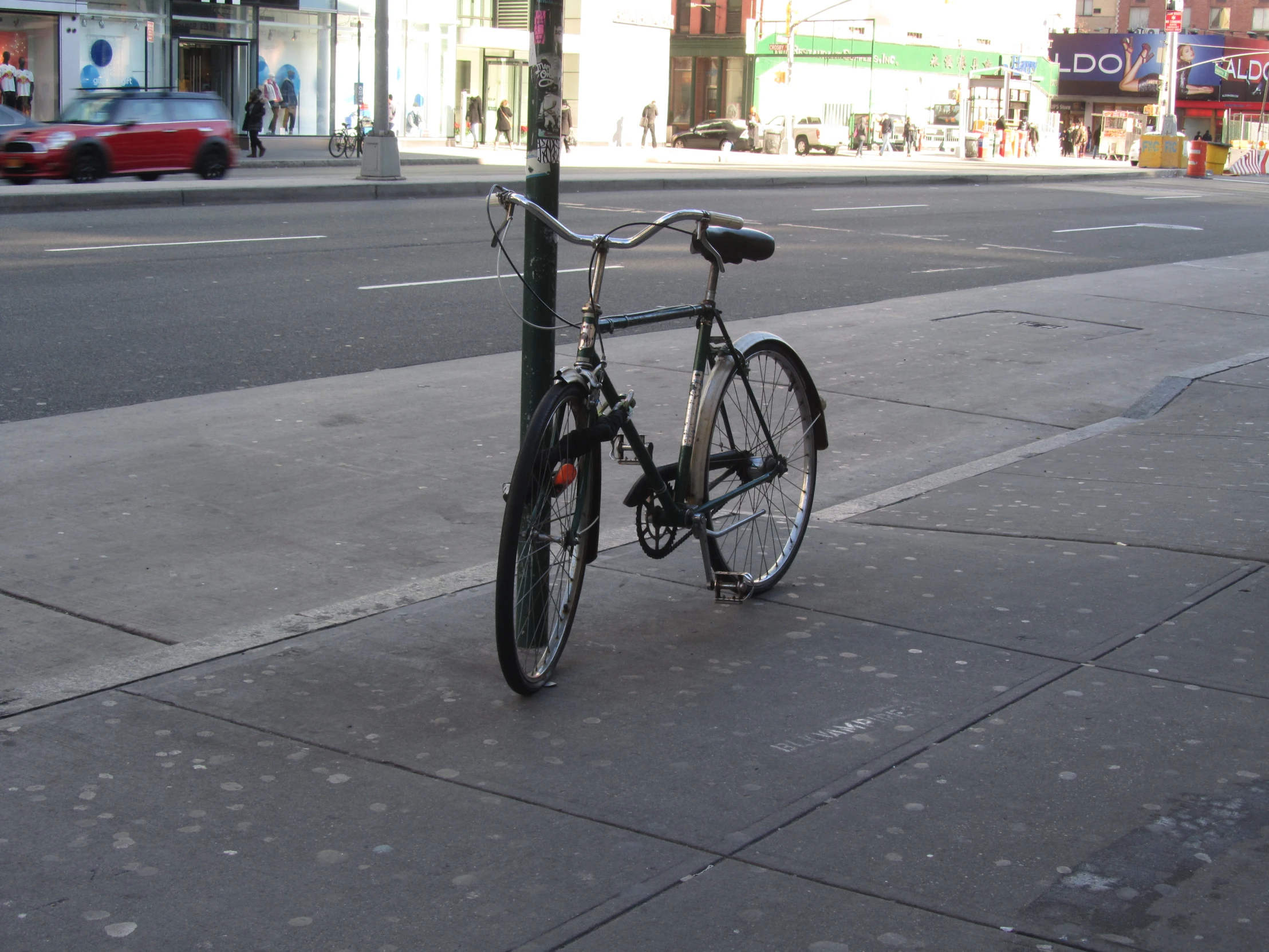 bike leaning up against the side of a street