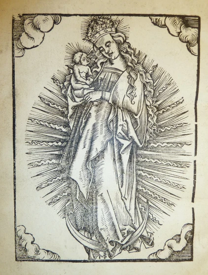 an old fashioned religious book with a drawing of mary and jesus